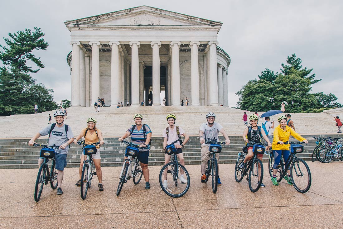 Group enjoying a cycling tour through the monuments in Washington DC, USA