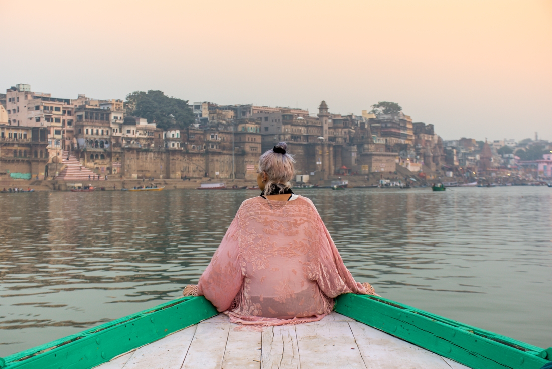 india varanasi traveller on boat ghat view
