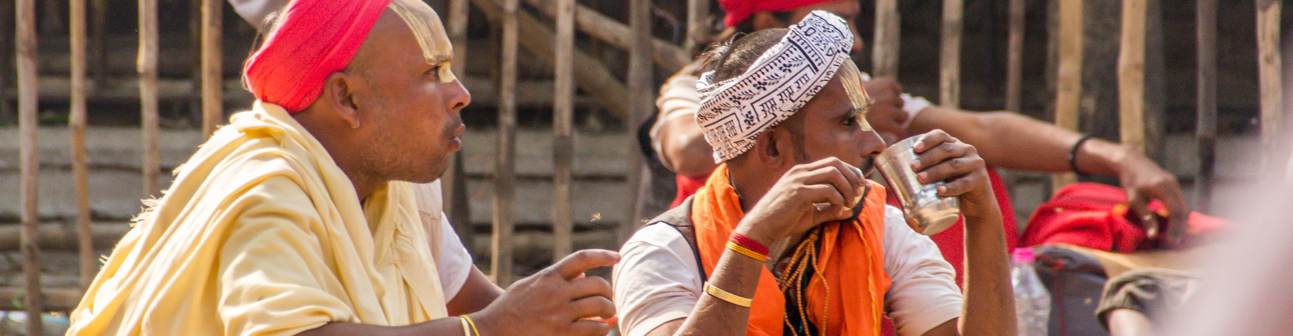 Local men drinking tea wearing traditional dress in Varanasi, India 