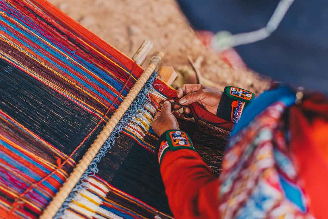 Local from Sacred Valley uses traditional weaving methods