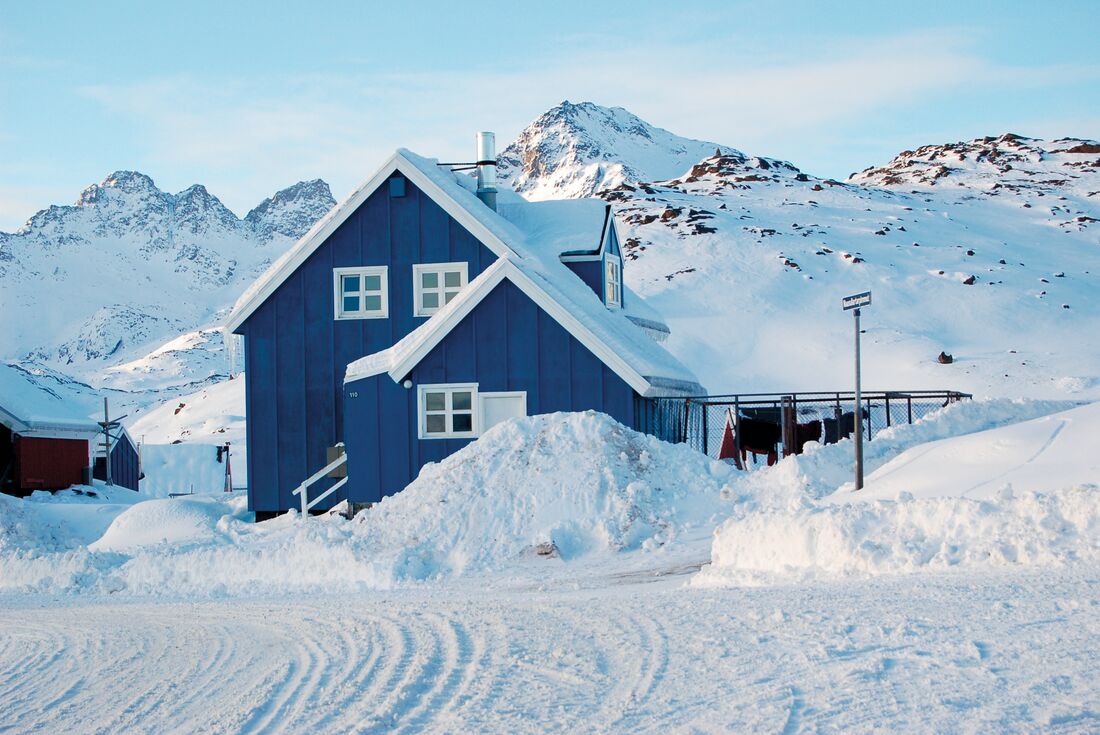 Blue house in the snow in Greenland