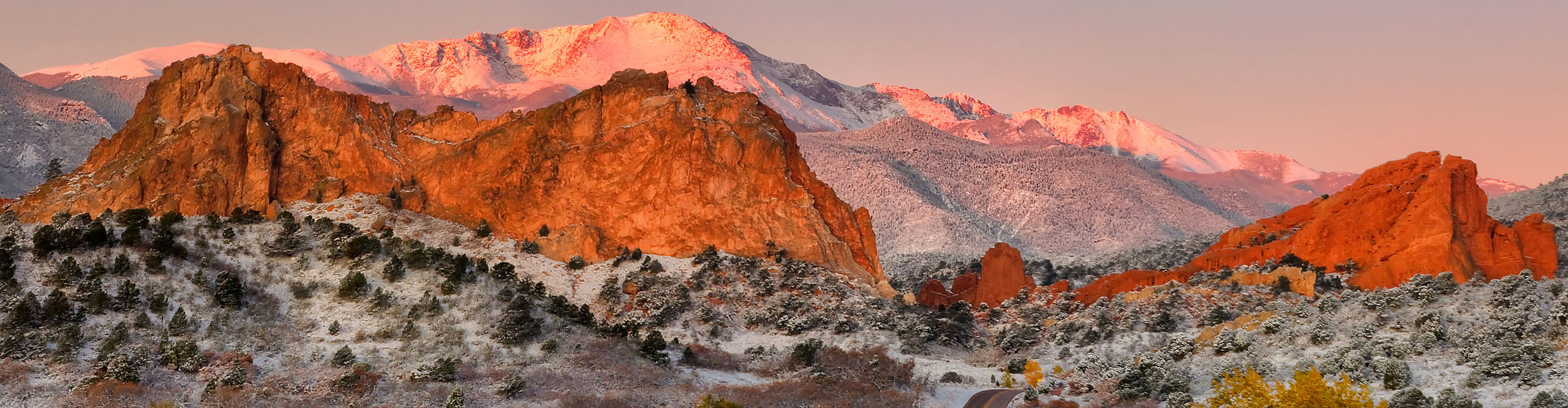 A Pink Sunset over Pikes Peak mountains at Garden of the Gods in Colorado Springs, in Autumn 