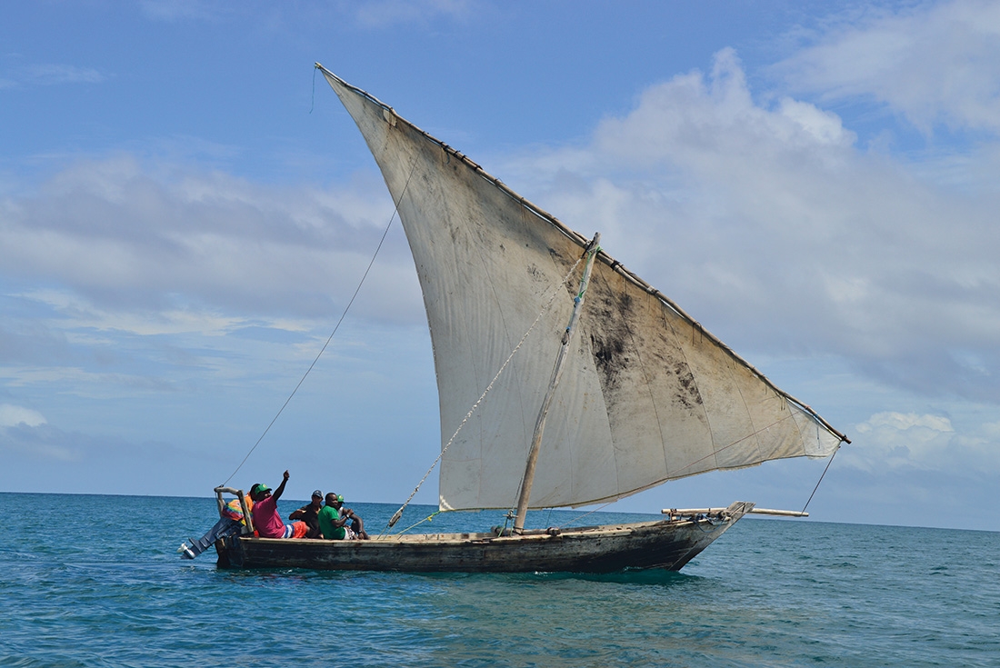 Fishermen sailing off the coast of Zanzibar