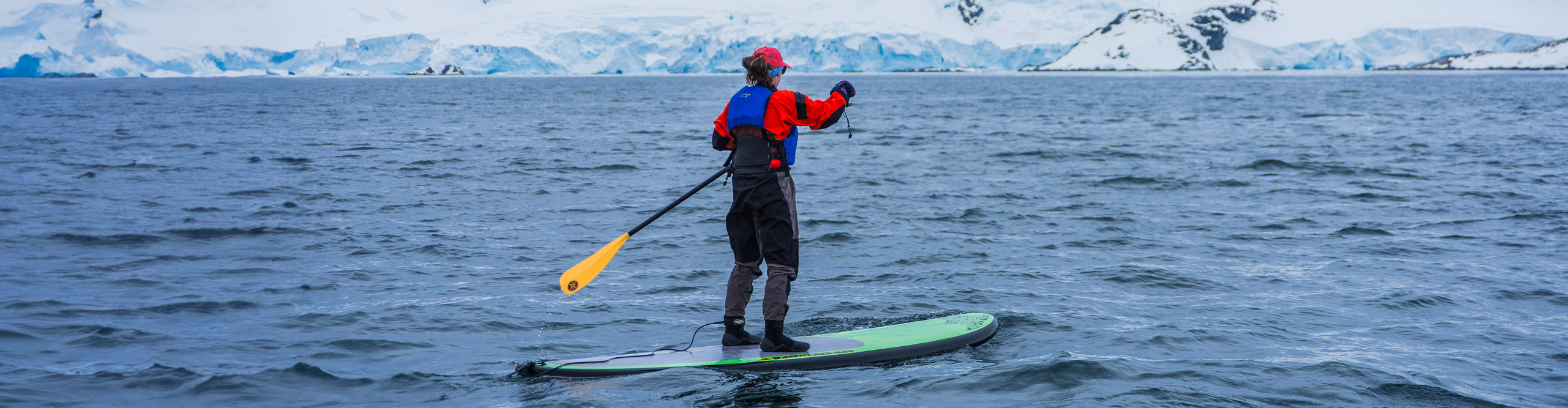 Women on paddle board in Antarctica 
