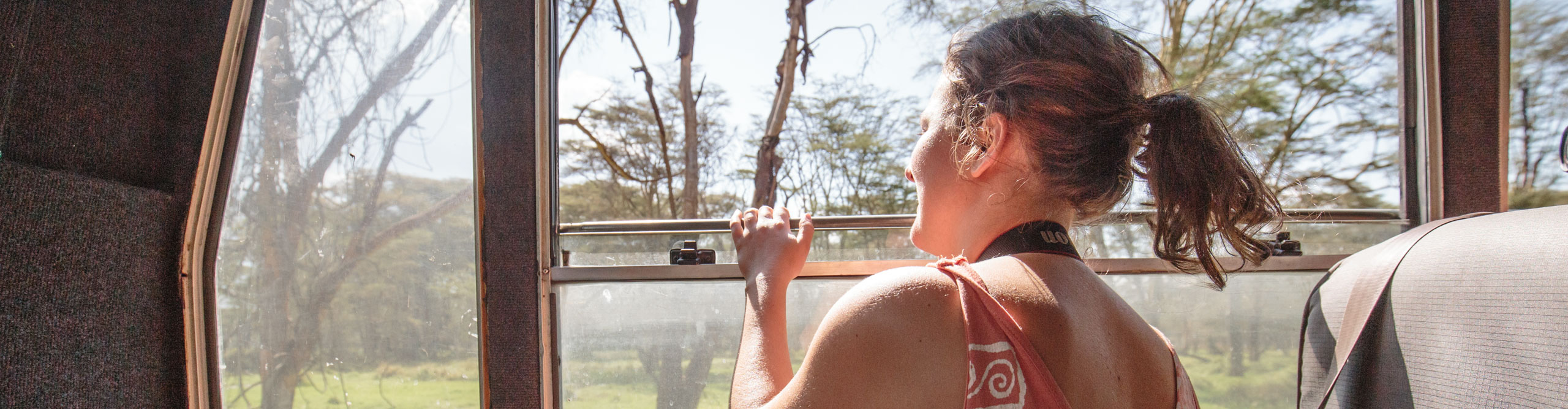 Women on bus looking at wildlife in Nairobi, Kenya