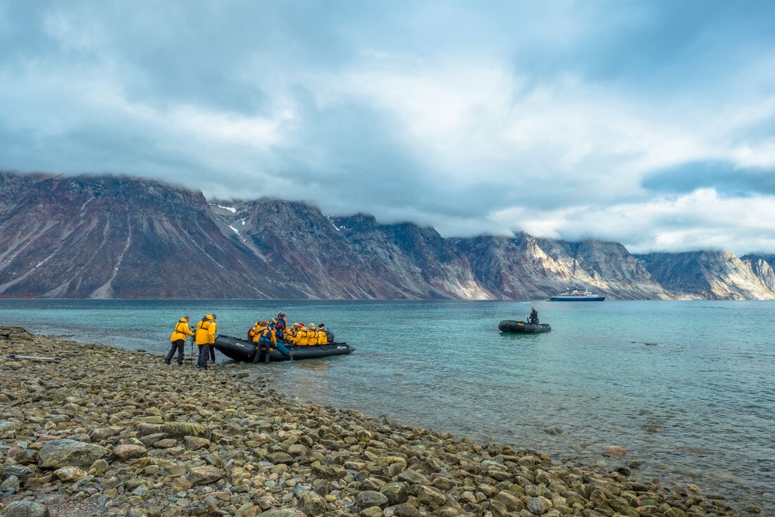 Passengers land on Sam Ford Fjord in a Zodiac boat in the Canadian Arctic