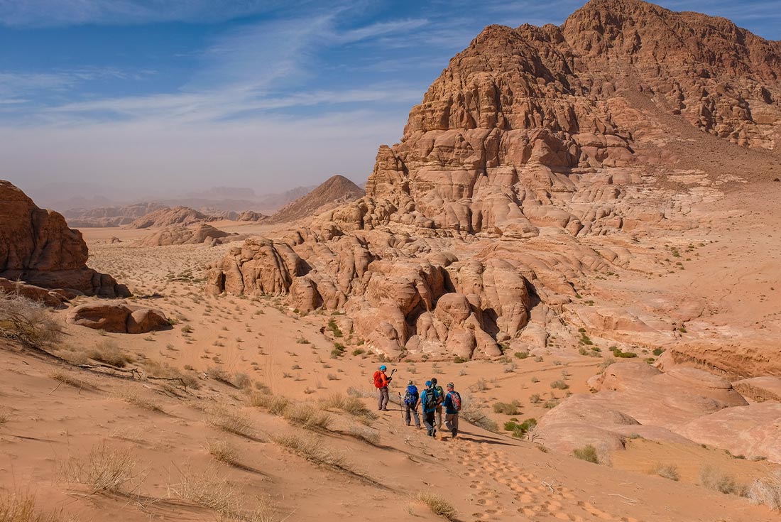 Hikers on trail in Wadi Rum desert, Jordan