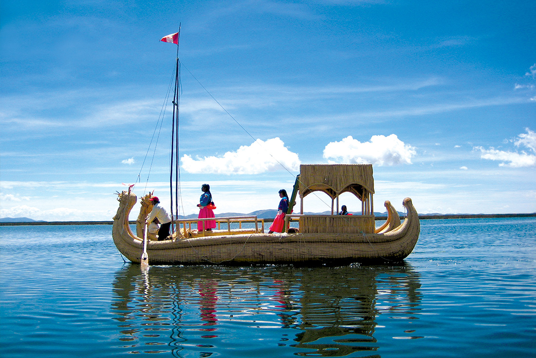 Locals on reed boat, Lake Titicaca, Peru