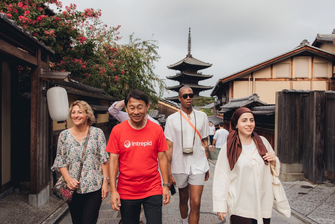 Group of Intrepid travellers with leader Hiro exploring the historic streets of Sannenzaka and Ninenzaka