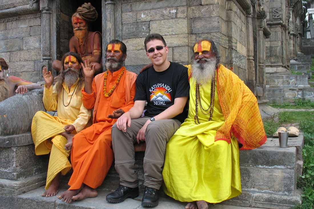 Traveller with a group of Sadhu's in Kathmandu, Nepal