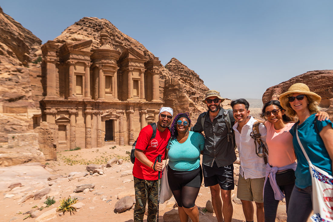 Group and tour leader in front of Petra ruins