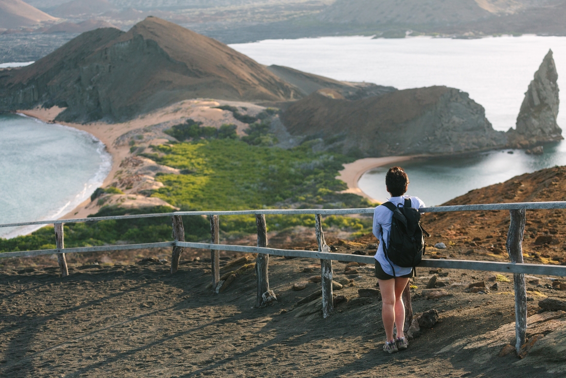 Traveller looking over Galapagos Island landscape, Ecuador