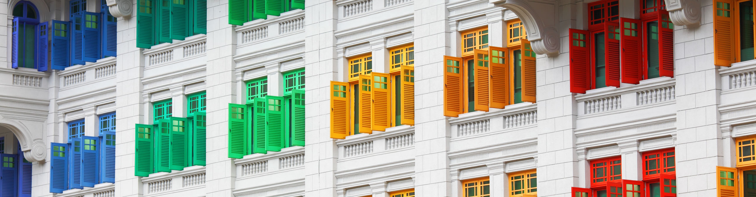 Rainbow coloured windows of a heritage building in Singapore 