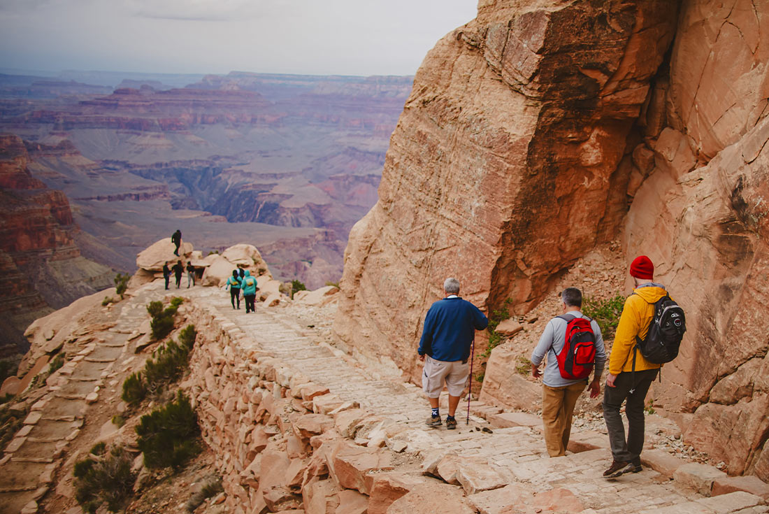 group hiking along the trail in the Grand Canyon, USA