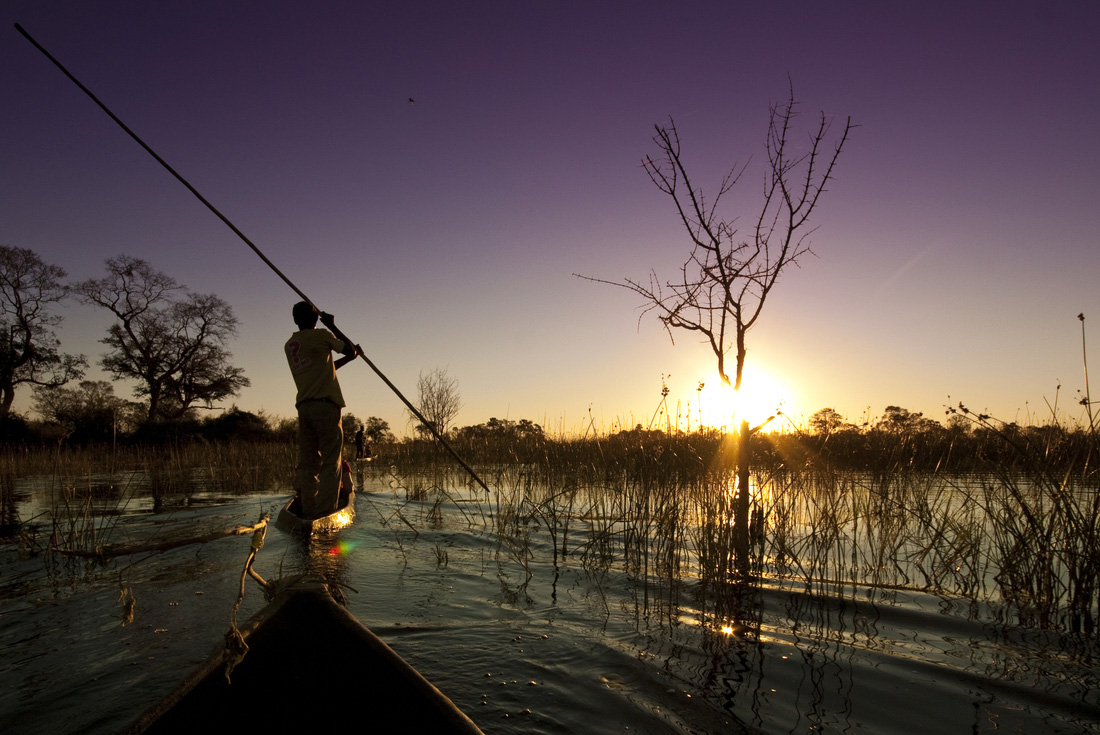Peregrine Adventures botswana okavango delta river mokoro sunset