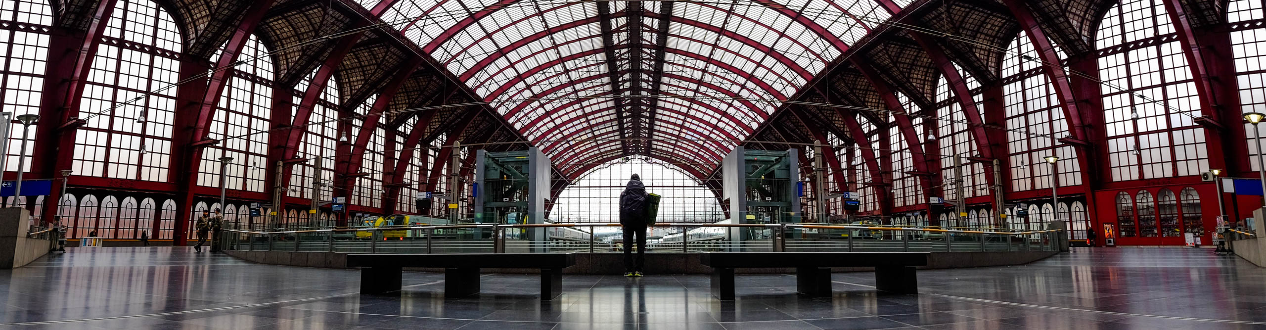 Woman standing on the platform of Antwerp train station, Belgium 