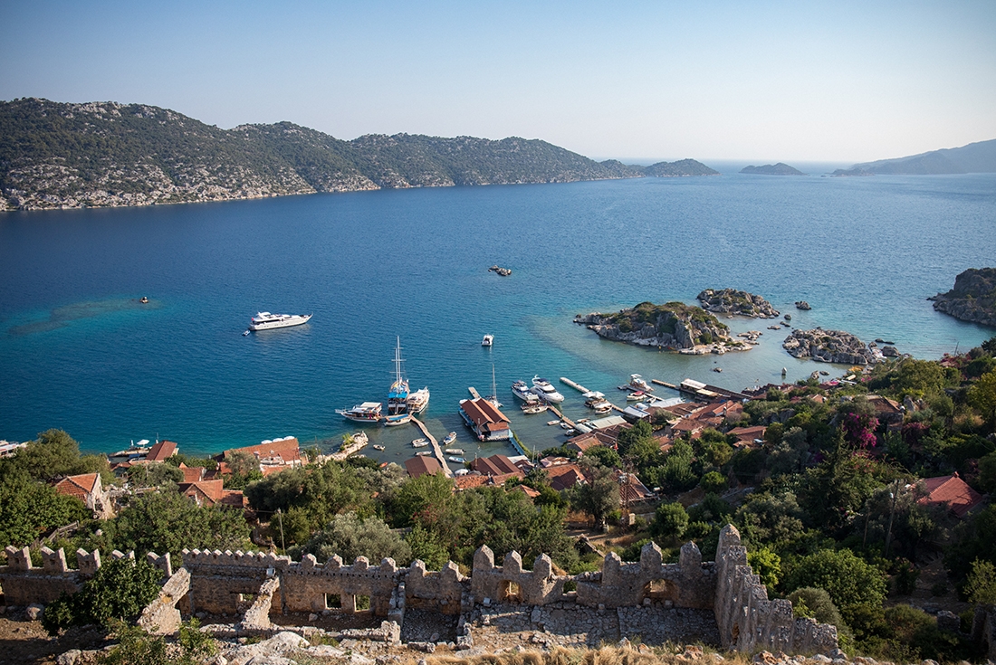 Looking out at the blue water of the Mediterranean Sea with the town of Kas in the foreground