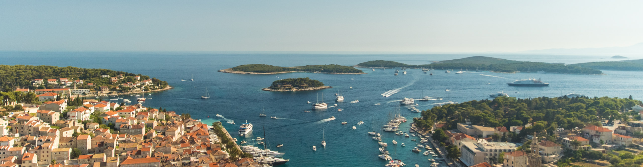 View of coastline and boats on a clear sunny day in Croatia 