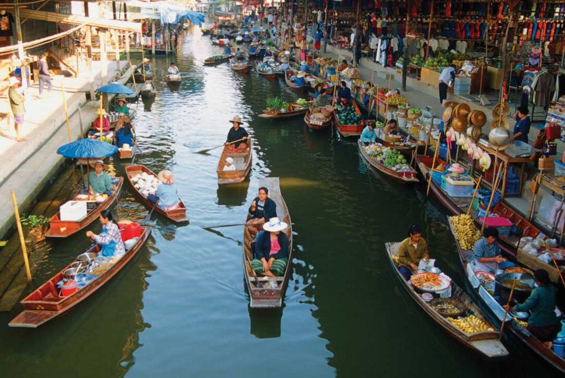 Boat vendors float down the river at the floating markets in Bangkok