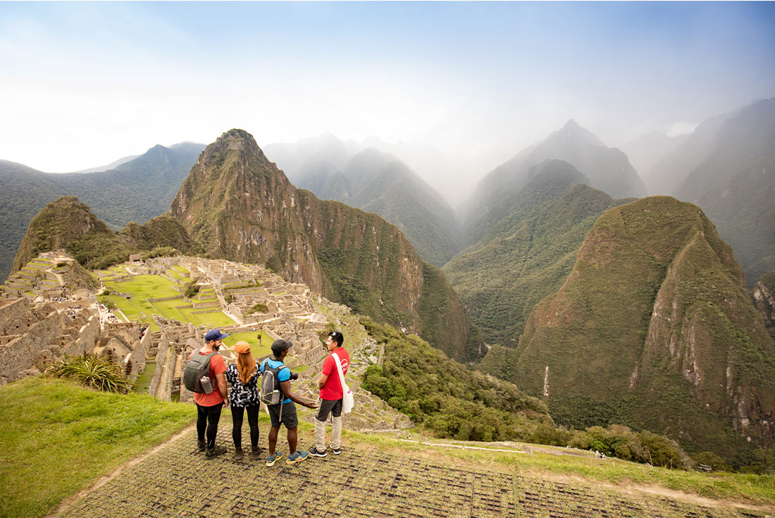 GGPI - Group of travellers standing viewing Machu Picchu from a distance