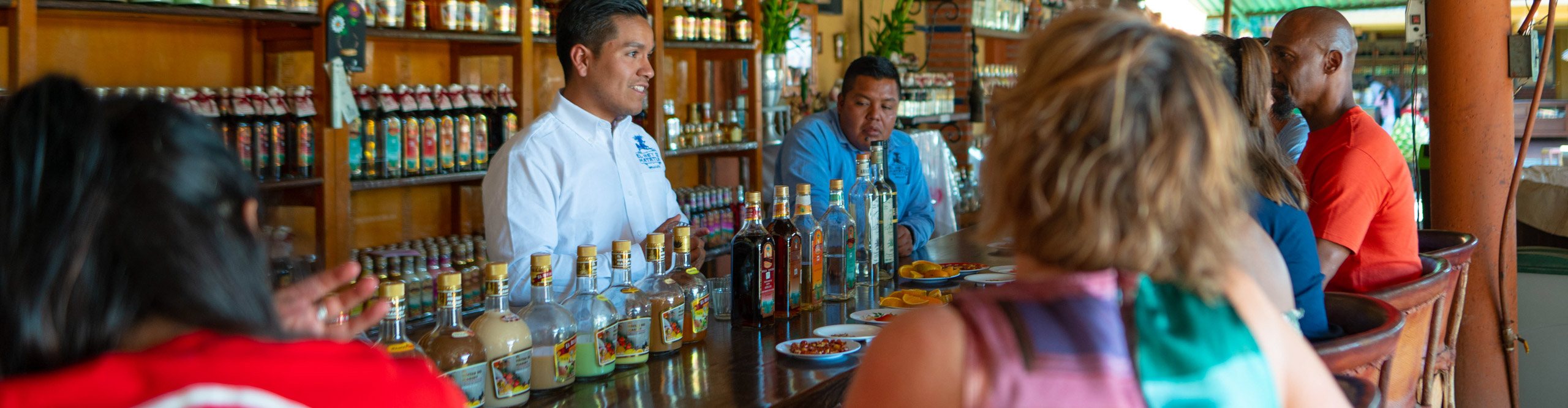Group at bar doing tequila tasting in Mexico 