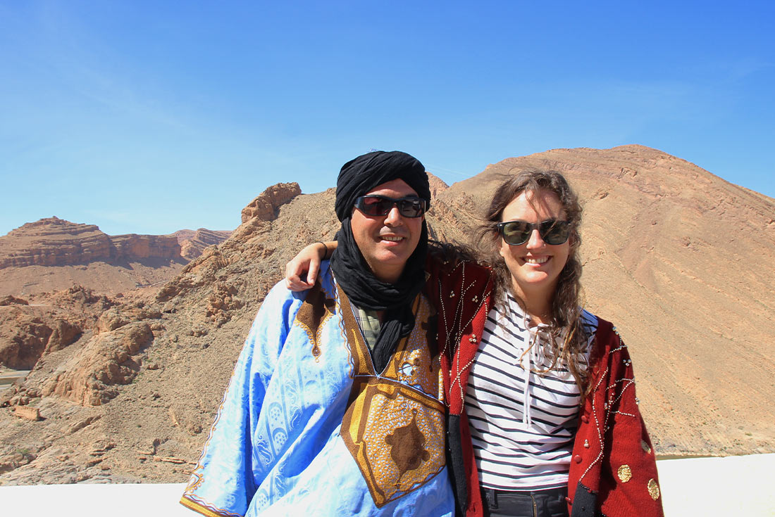 Traveller with berber in high atlas mountains, Morocco