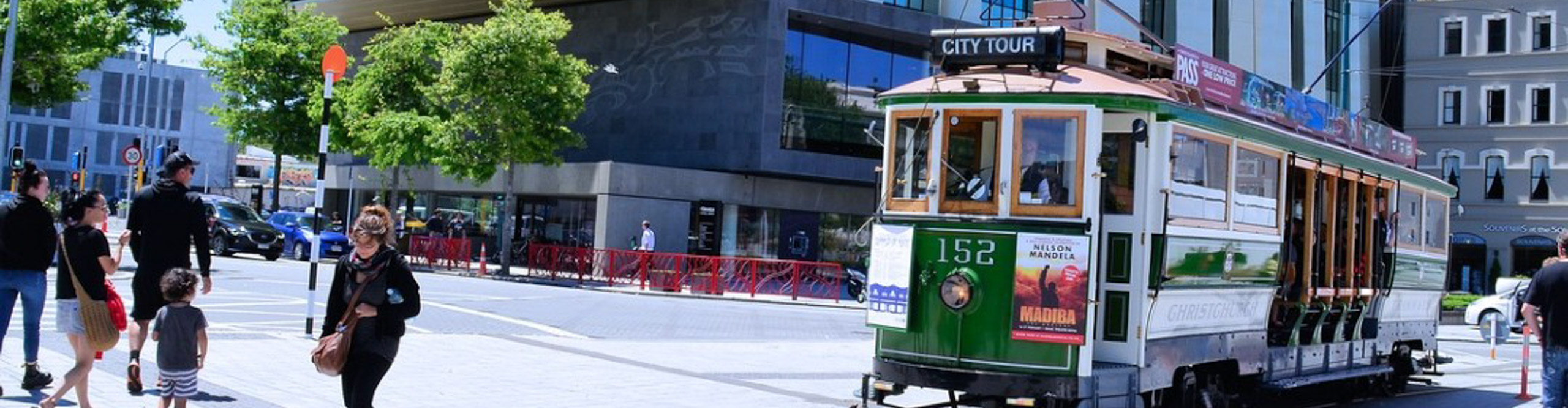 Tram car going through the streets of Christchurch on a clear sunny day, New Zealand 