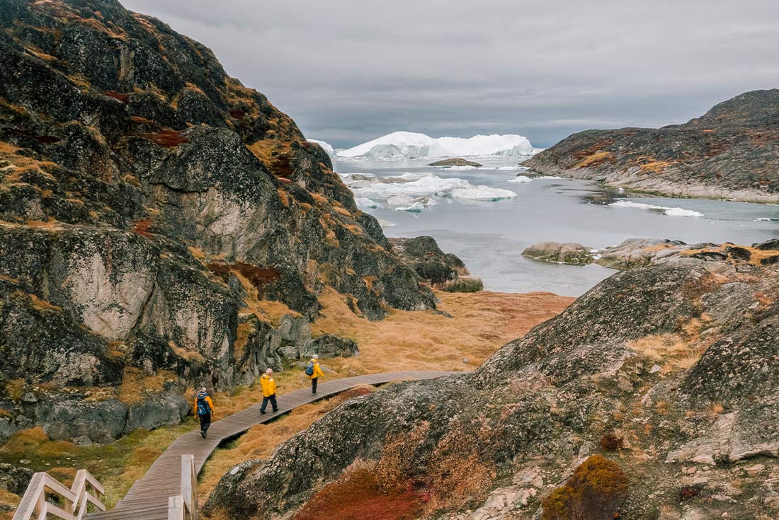 Travellers exploring Ilulissat Icefjord in West Greenland