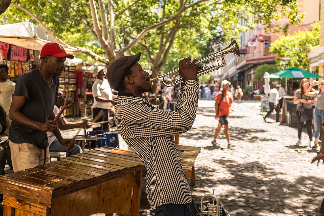 A local musician plays the trumpet in the streets of Cape Town