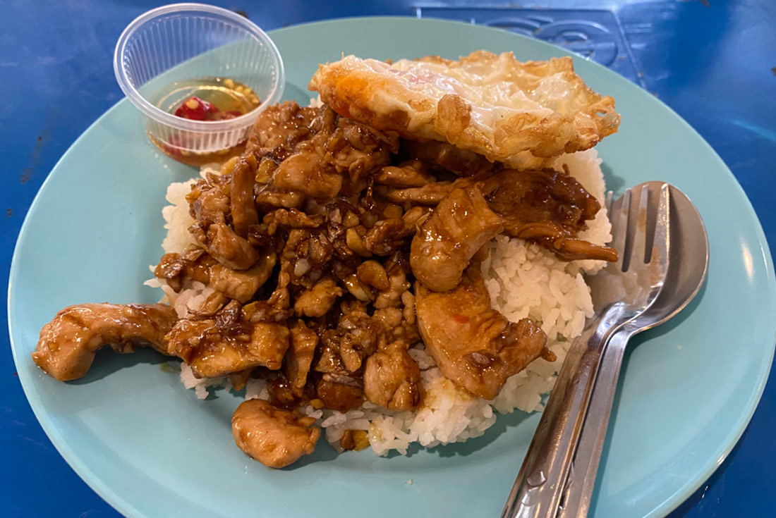 A plate of Pad Kra Prao, a traditional street food dish in Bangkok, Thailand