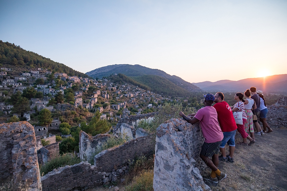 Intrepid Premium group looking over the ancient city of Kayakoy, Turkey