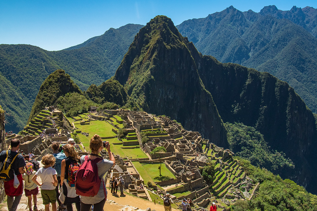 Travellers taking photo at Machu Picchu, Peru