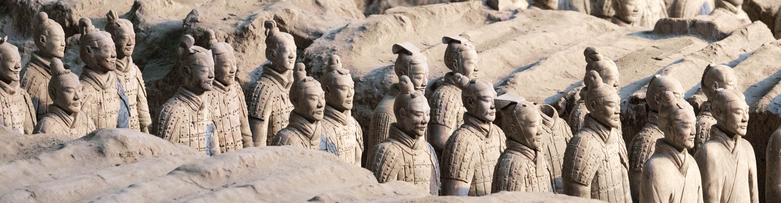 Terracotta warriors stand in the position where they were unearthered near the city of Xian, China