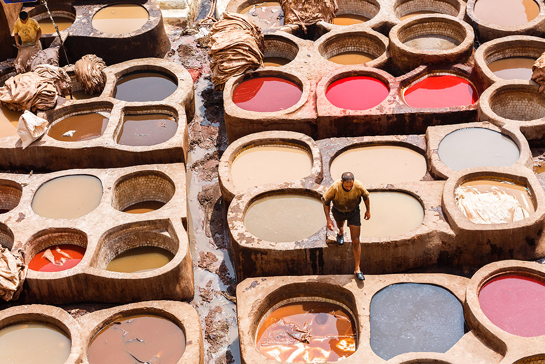 Close up view of local man at leather tanneries, Fes, Morocco