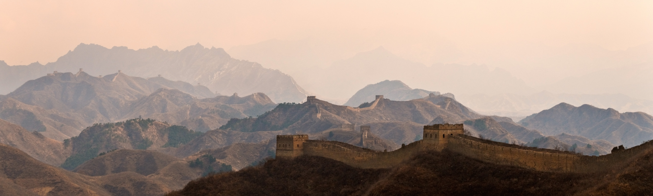 View of the Great Wall of China between Jinshanling and Simatai near Beijing at dawn on a misty day