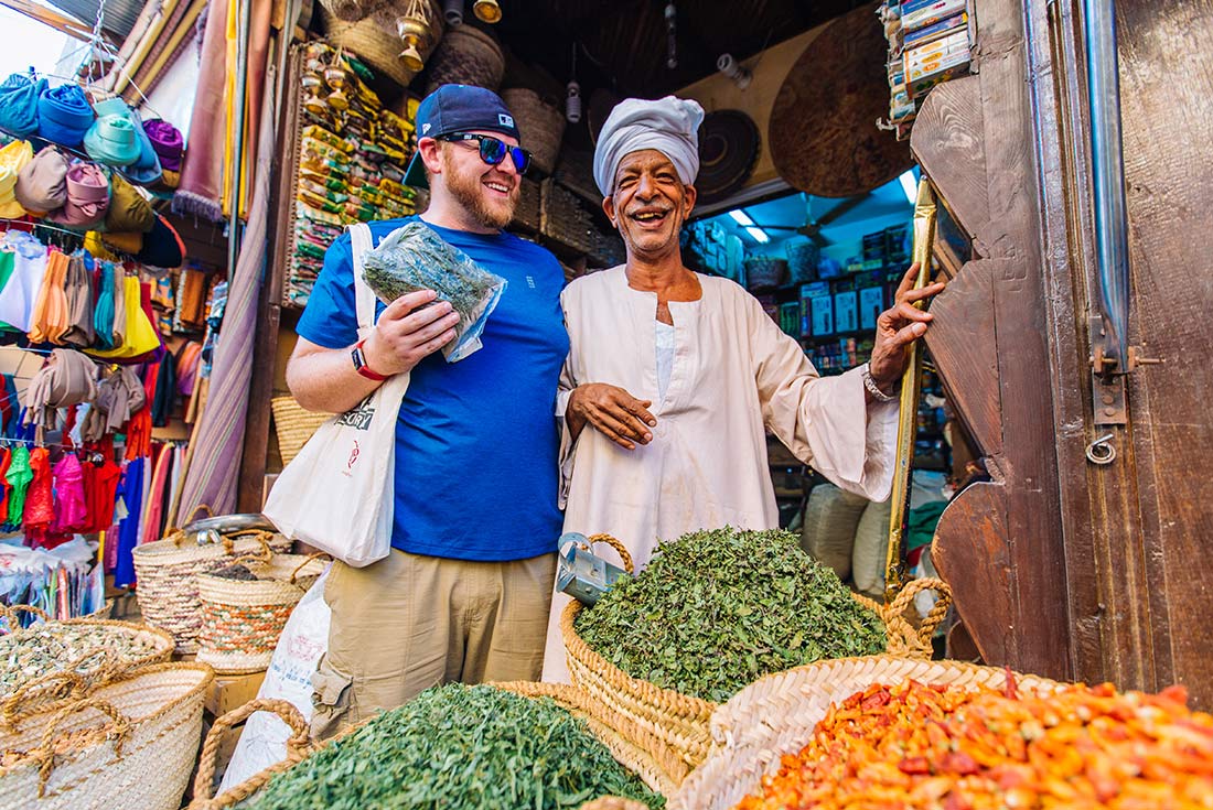 Traveller bargaining with a trader in Aswan, Egypt