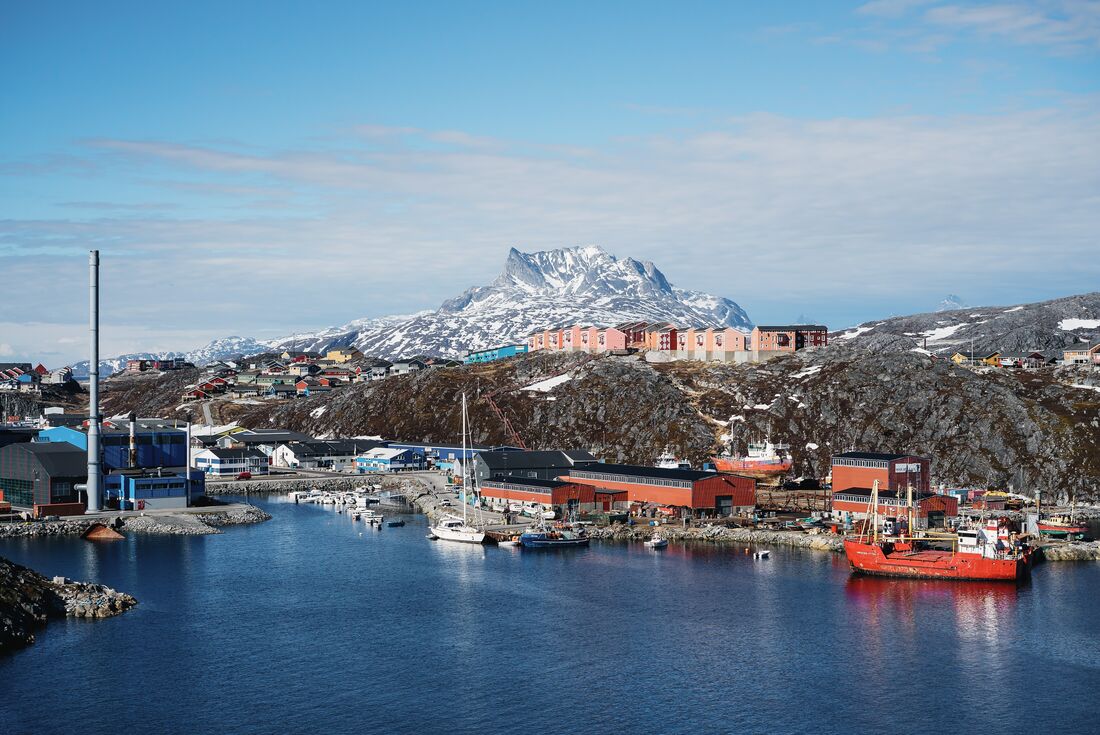Boats in the harbour at Nuuk, Greenland, with mountains in the background