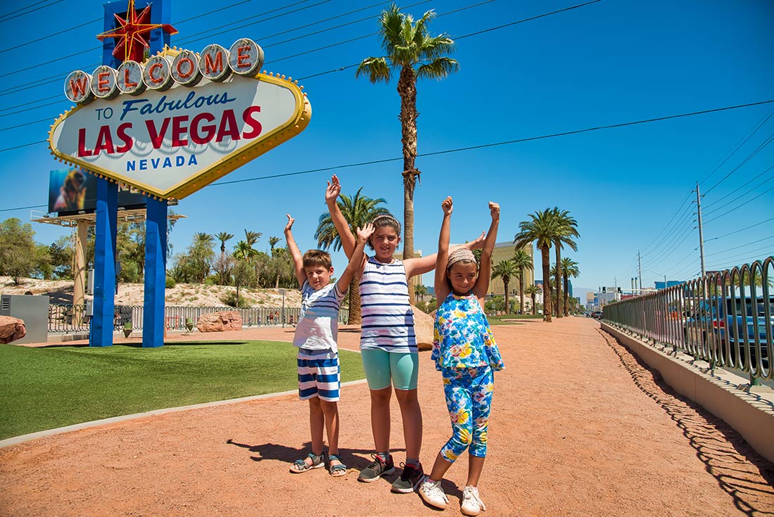 Children in front of the landmark Las Vegas Sign