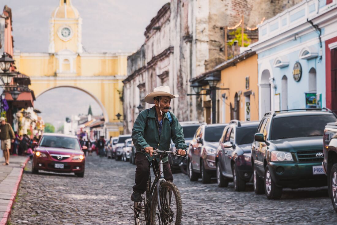 Local man rides bike down main street of Antigua 