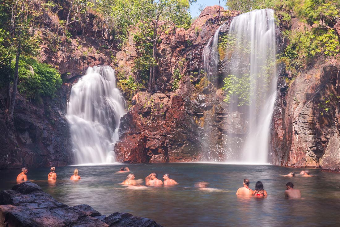 Group of travellers swimming in Florence Falls, Litchfield NP
