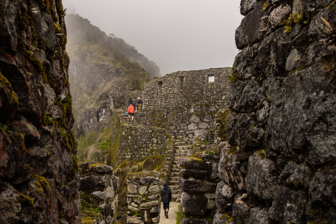 Intrepid travellers at Sayacmarca Archaeological site on the Inca trail in Peru