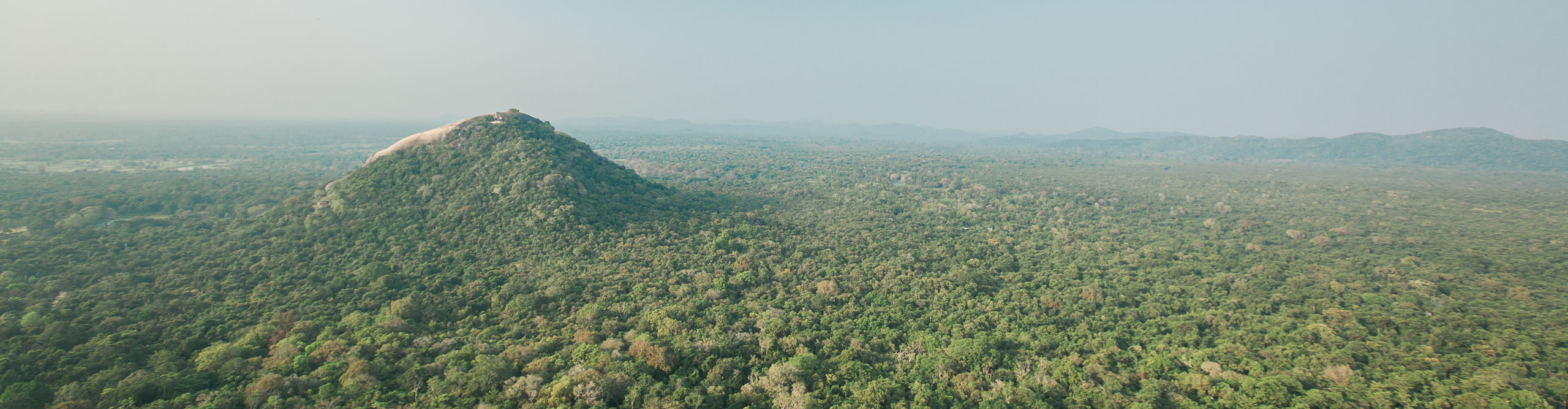 Misty aerial shot  of the mountains and jungle in Sri Lanka